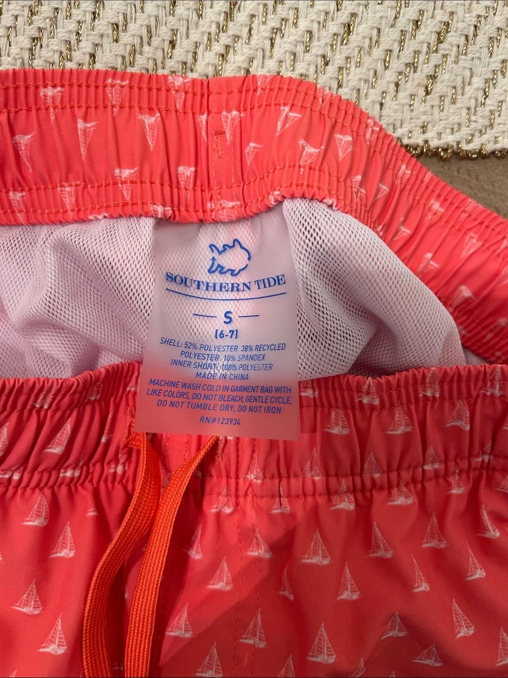 Southern Tide Coral Pink Boys' Swim Trunks with Tiny White Sailboats